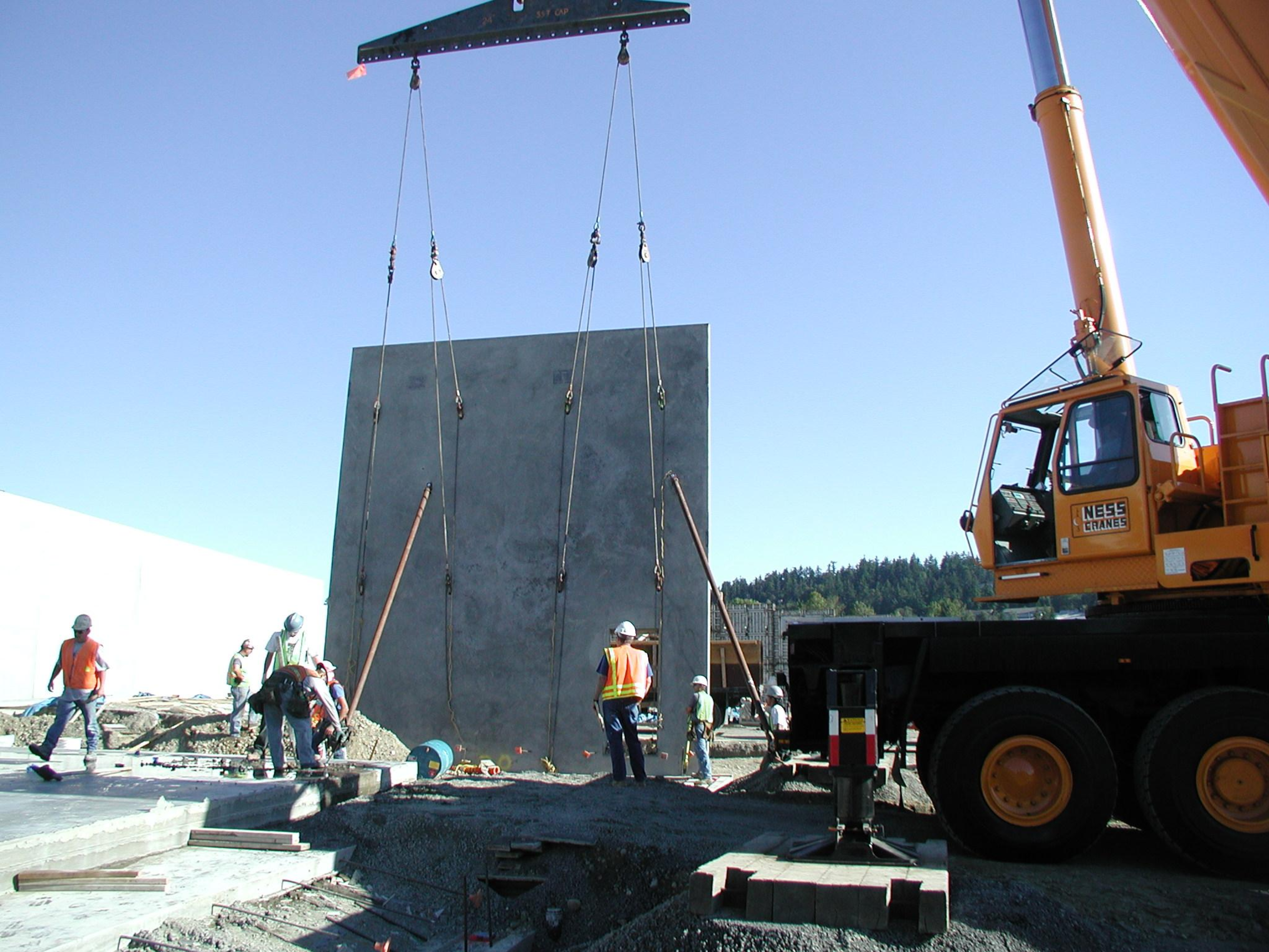 Concrete tilt-up panel construction and erection